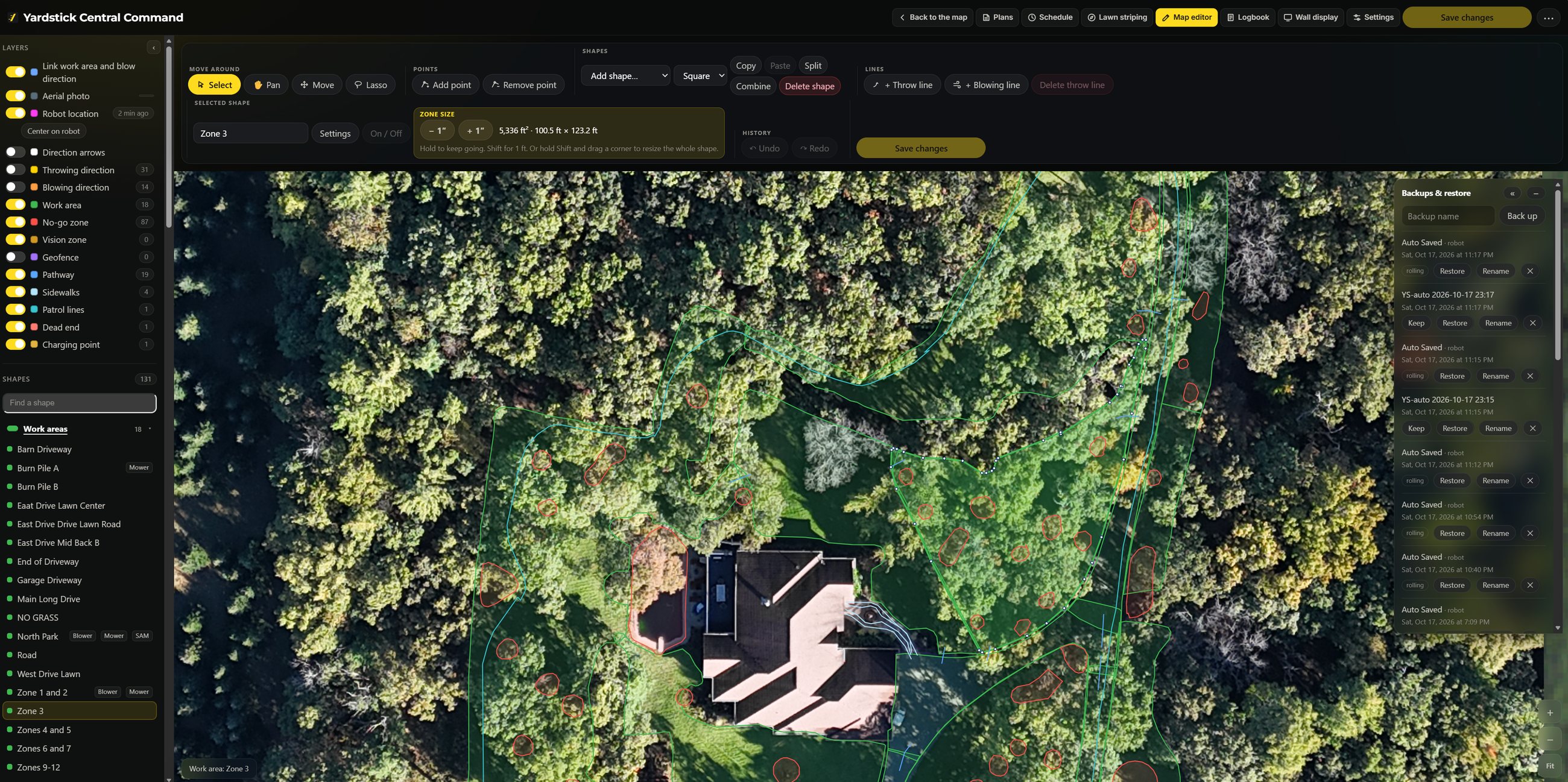 The Yardstick desktop map editor on a wide screen, zoomed in on the yard with one zone selected and its size shown: work areas, no-go zones and pathways drawn over an aerial photo of the property, the full editing toolbar, a layers panel including sidewalks, and a backup and restore tray