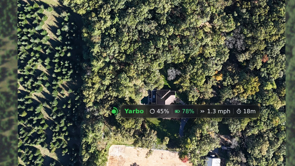 The Yardstick wall display live map, zoomed to the robot as it mows the yard with its stats riding alongside it